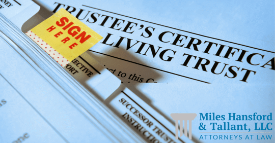 paperwork about living trust, 'sign here' sticker